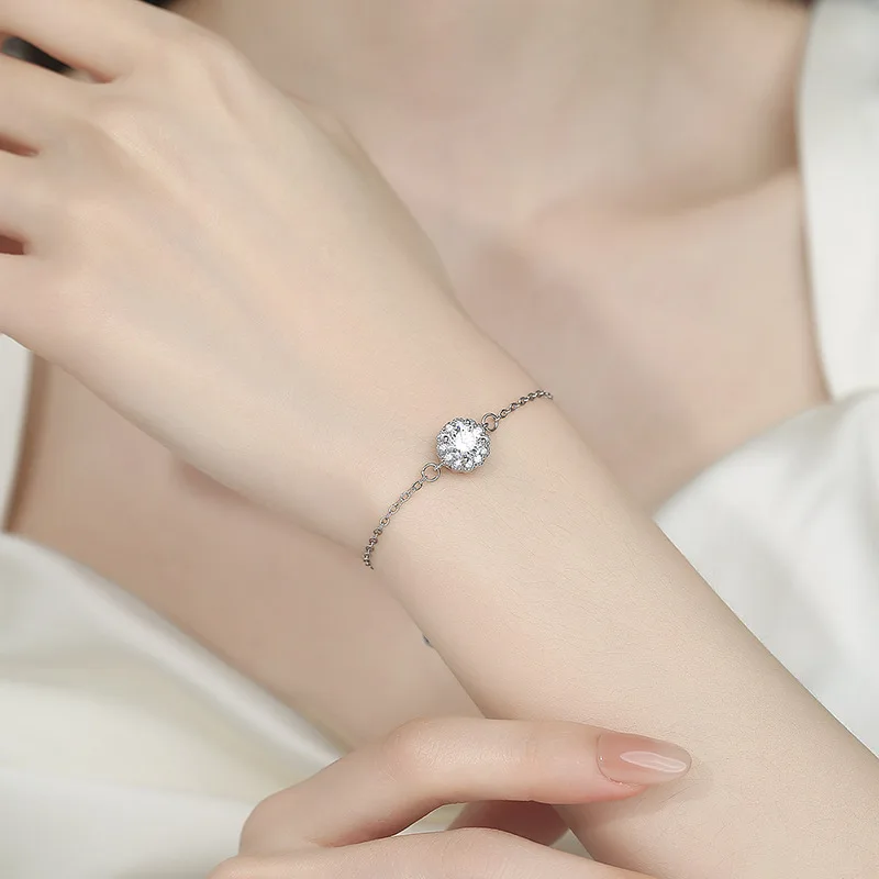 Elegant Korean-inspired camellia-shaped bracelet crafted from electroplated copper in white gold finish — delicate floral design