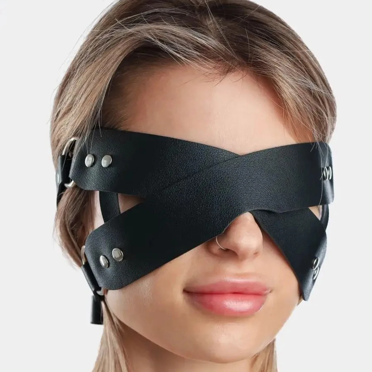 

Luxury leather blindfold with adjustable straps and crisscross design Crafted for sensual roleplay and intimate encounters