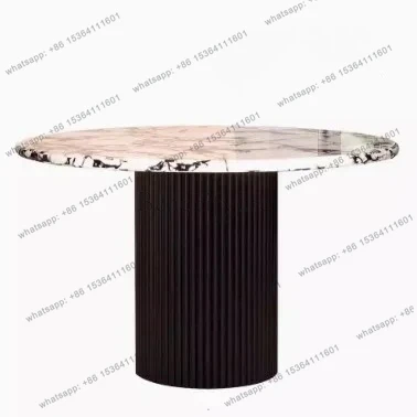

High-end round dining table French marble slate retro modern light luxury small apartment model