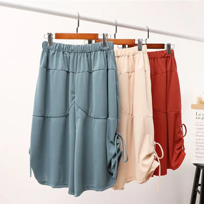 Pantalones bombachos de cintura elástica para mujer, ropa holgada de gran tamaño, Color sólido, a la moda, con bolsillo que combina con todo