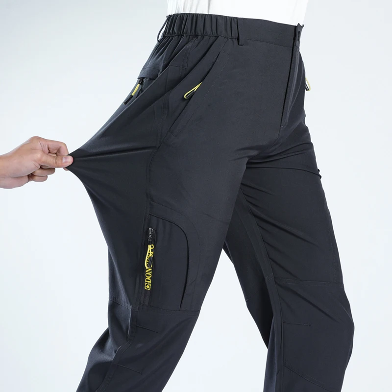 

Летние быстросохнущие тактические брюки 5XL для мужчин, эластичные, водонепроницаемые, с карманами на молнии, легкие, для рыбалки, 2026