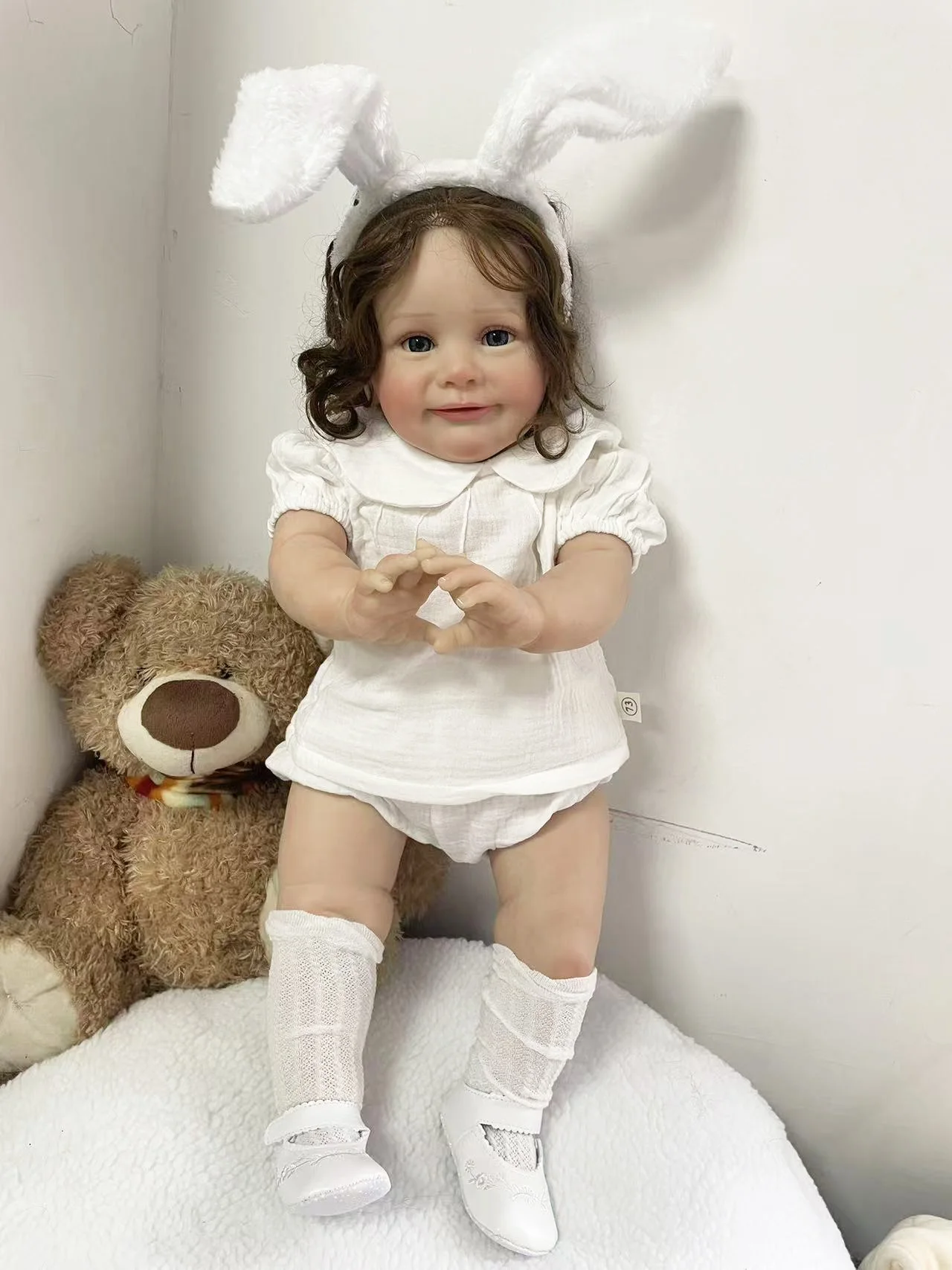 25Inch Lifelike Cute Zoe Reborn Doll Hand Root Hair Wearing A White Short Sleeved Clothing Set and White Rabbit Ear Headband