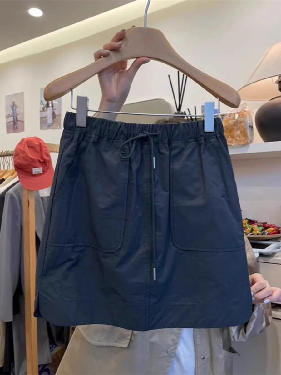 

Юбка А-силуэта в американском стиле для женщин, лето 2024, с эффектом похудения, с карманами, прикрывающая бедра, расклешенная