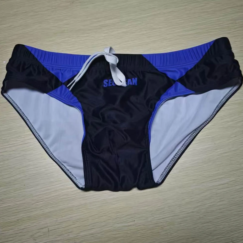 2026Real shot real summer new men's classic cross-border men's triangular seaside swimming trunks hot spring pants230901