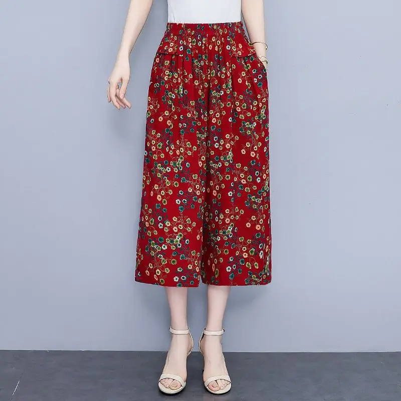 高齢者の女性の夏の新綿シルクフラワーパンツ女性の 7 分ワイドレッグパンツ弾性ハイウエストルーズスカートパンツ