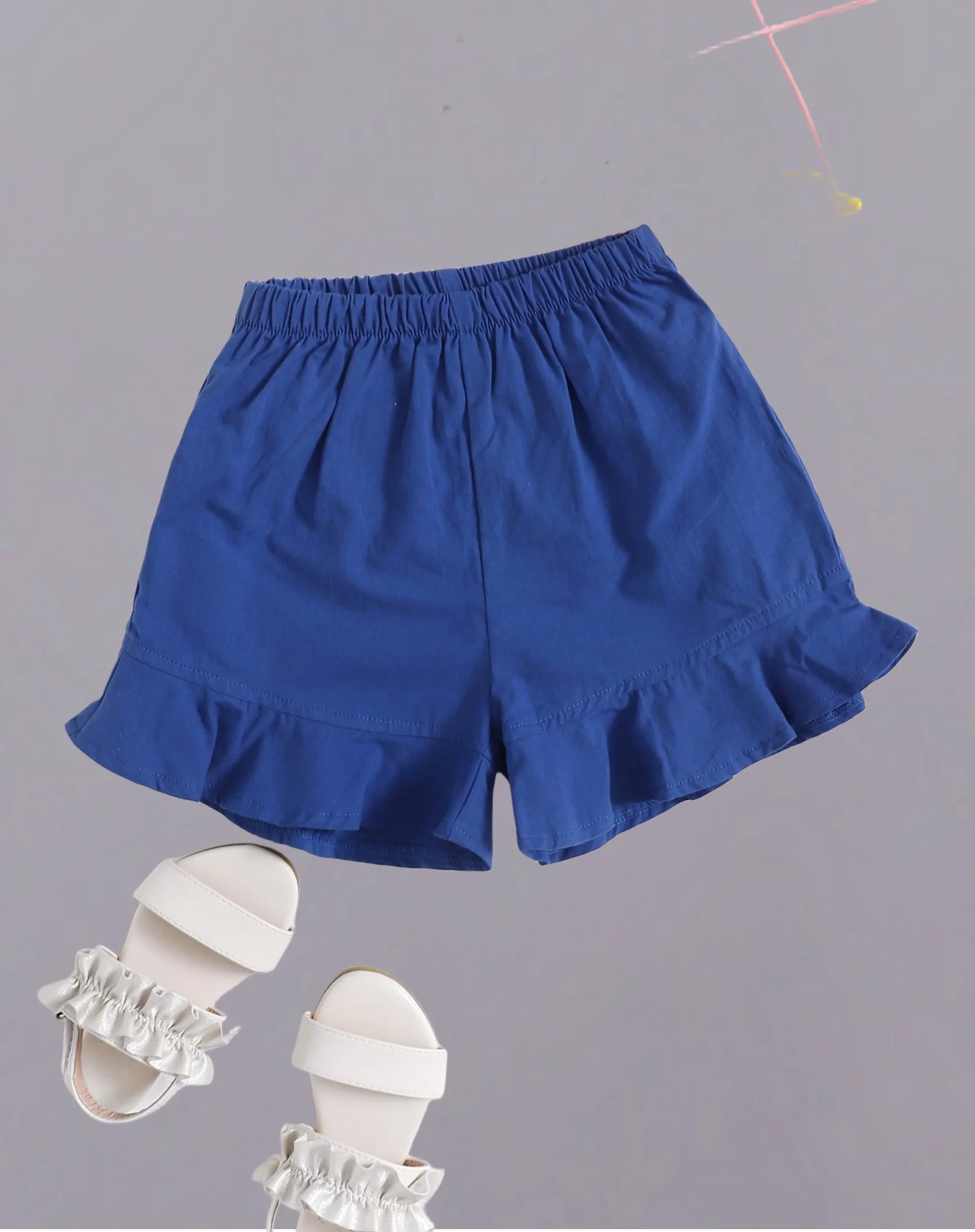 Girls' dark blue ruffled shorts - comfortable elastic waist design