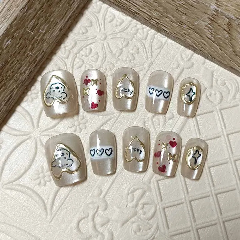 10 ชิ้นน่ารักการ์ตูนหัวใจสีทองและสุนัขกดบนเล็บสไตล์ฝรั่งเศส Polka Dot Bowknot เล็บที่ถอดออกได้ Cat Eye Design เล็บ