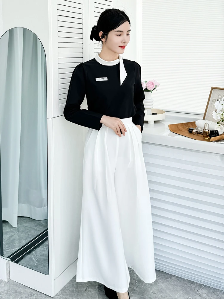 

Корейский стиль: Новинка осенне-зимнего сезона – элегантный комплект из юбки и брюк для салонов красоты, отелей, ресепшн и специалистов по здравоохранению