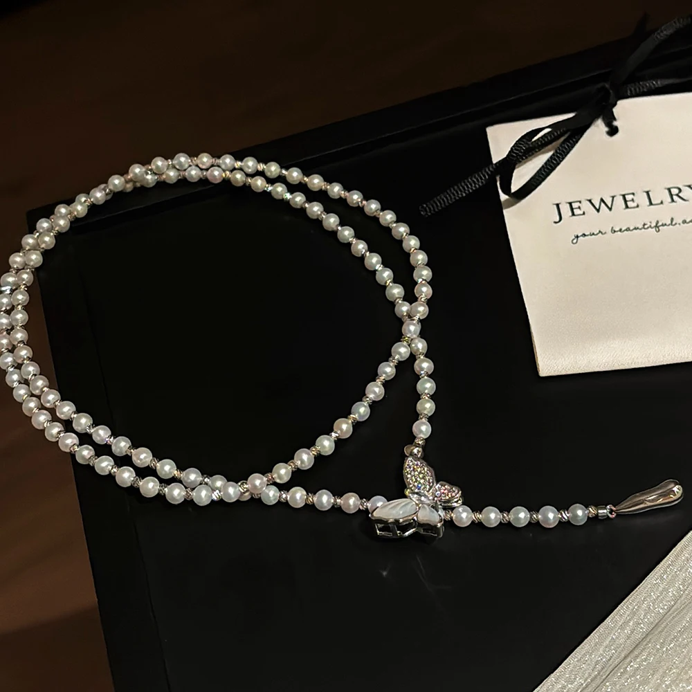 

Exquisite Butterfly Clasp Pearl Sweater Chain with 4-5mm Freshwater Pearls and Lively Teardrop Pendant for Sweet Ladylike Style