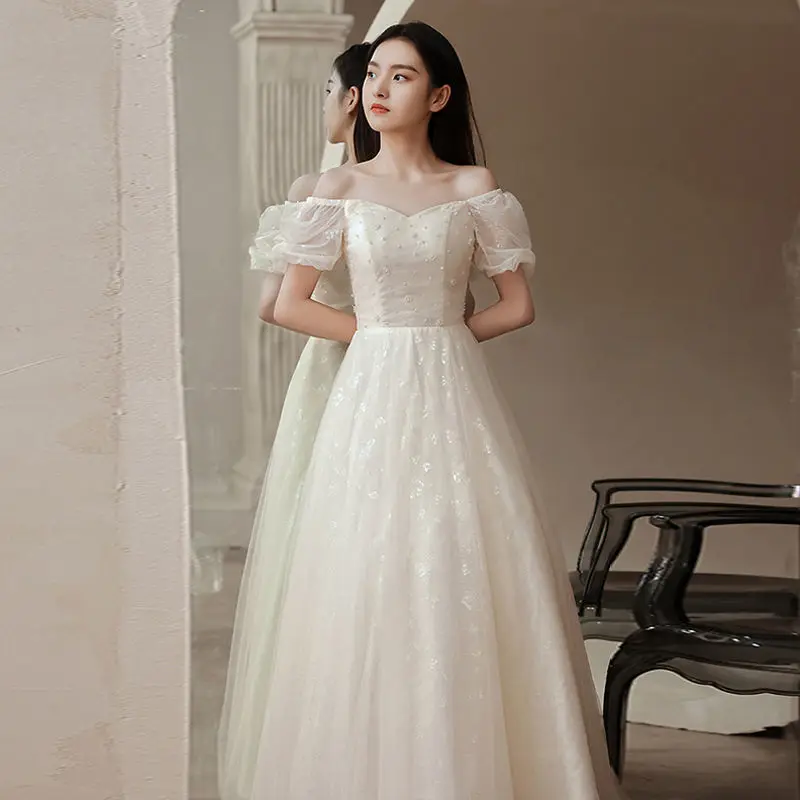 فستان سهرة أبيض متخصص نمط جديد مأدبة خرافية مزاجه الراقية نمط طويل الاجتماع السنوي استضافة فستان المرأة الربيع