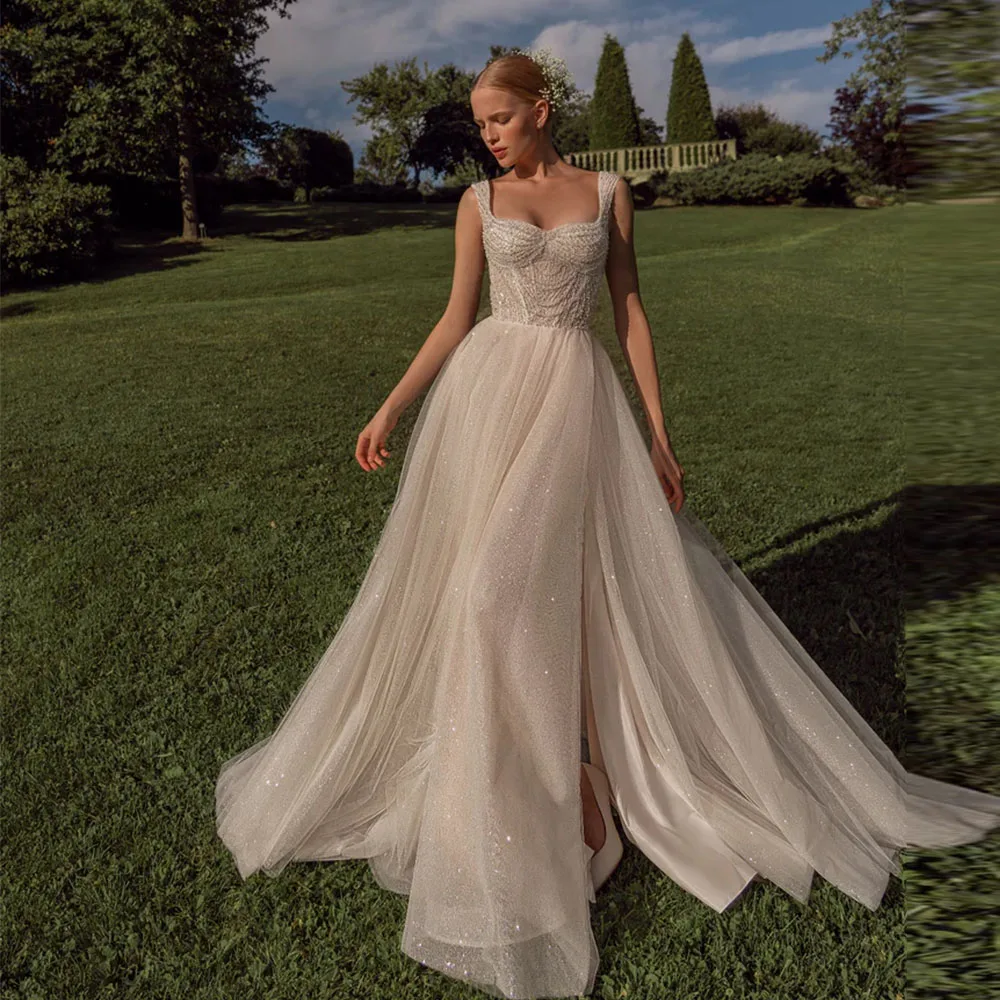 

Ivory Glitter Tulle A Line Wedding Dress Luxury Beading Sweetheart Sleeveless Bridal Gown Floor Length Side Slit Customized