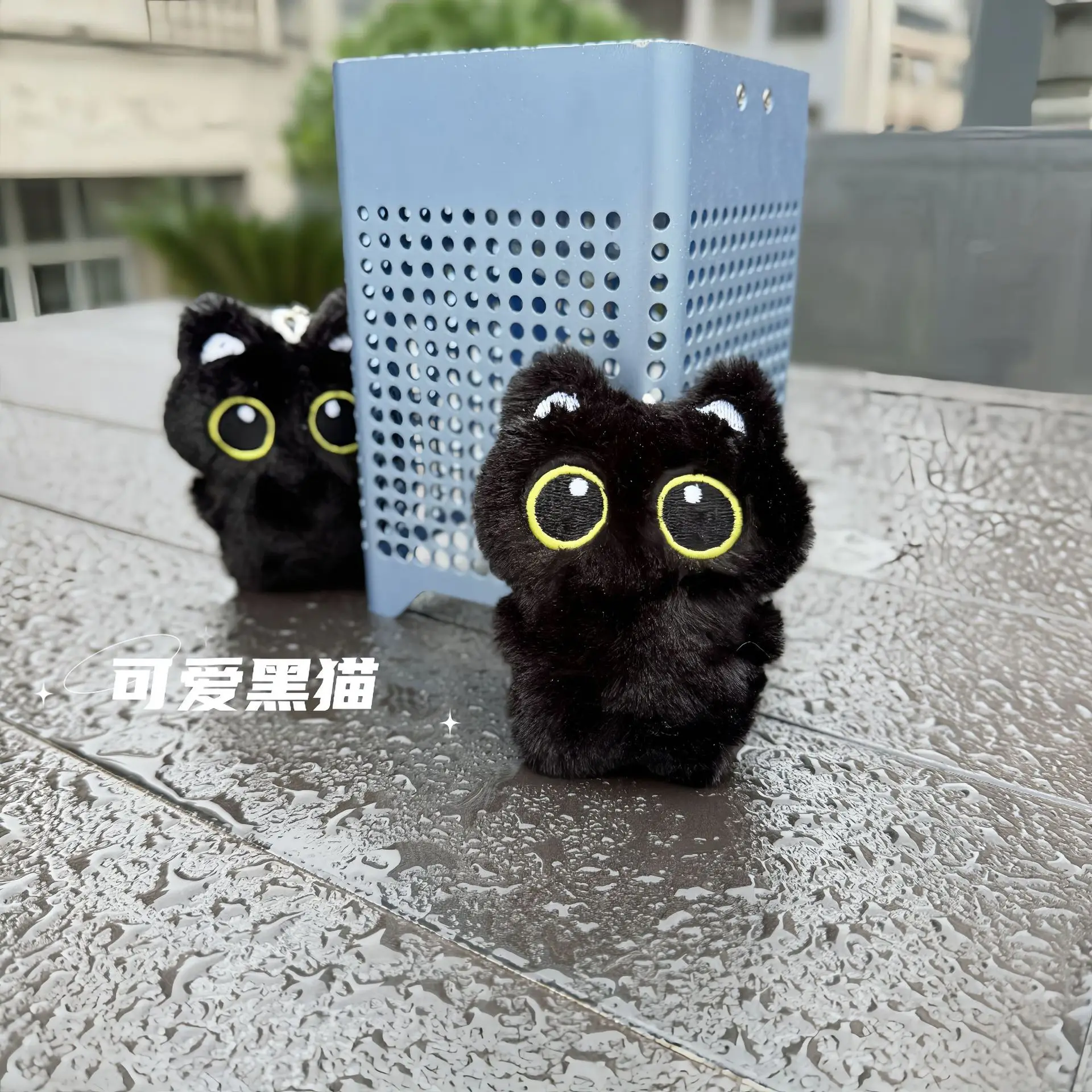 

Big-eyed black cat plush doll