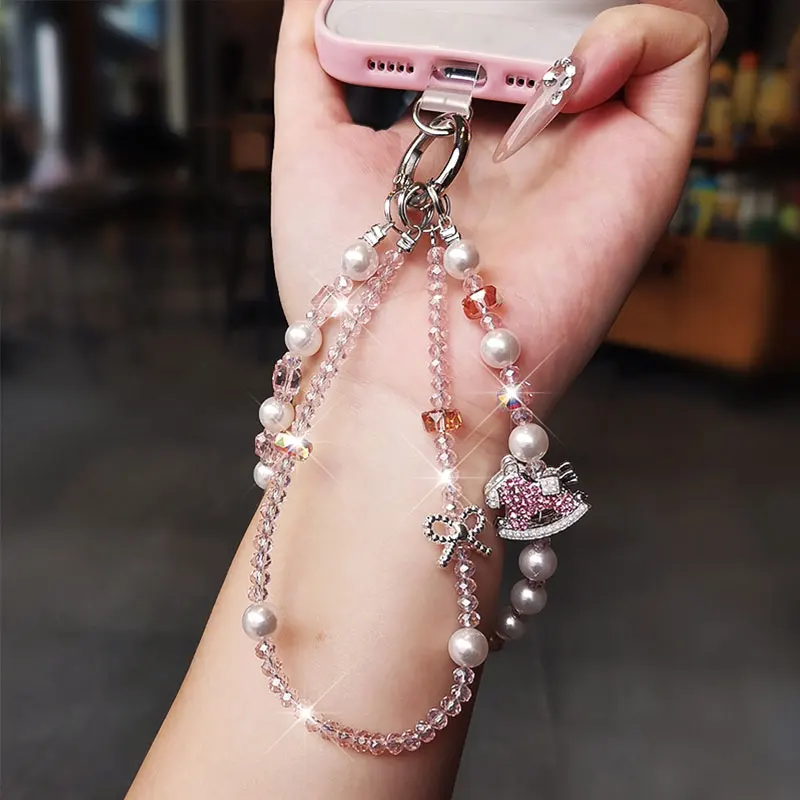 Bracciale da polso con cordino per telefono in cristallo scintillante con catena per telefono con fiocco di lusso e perla per accessori per custodie per telefoni