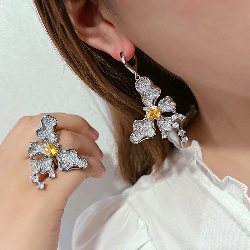 Butterfly Dangle Earrings Full Paved Clear Cubic Zirconia With Yellow Center Stone Tassel Drop Design Silver Tone