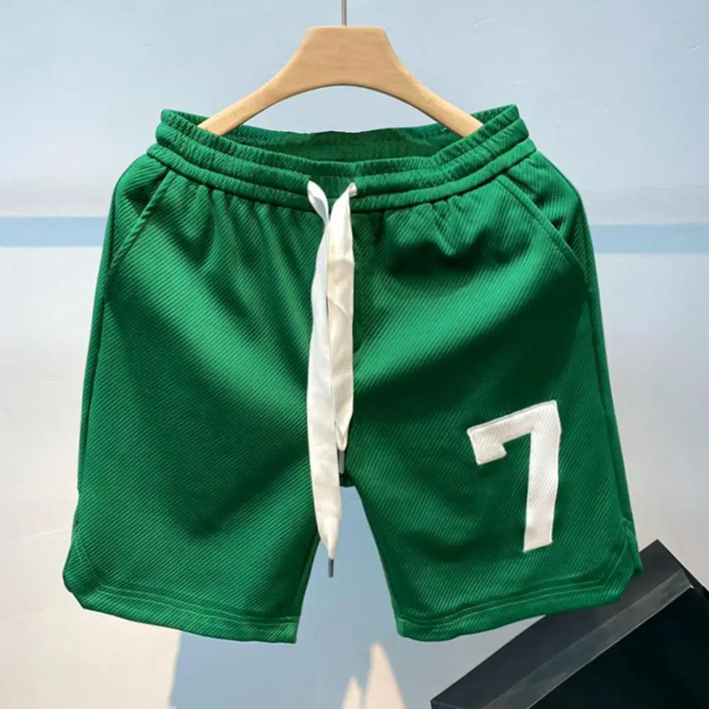 Pantaloncini da palestra da uomo traspiranti con coulisse elastico in vita pantaloni larghi numero stampa tasche morbide pantaloncini da ginnastica ad asciugatura rapida abbigliamento sportivo