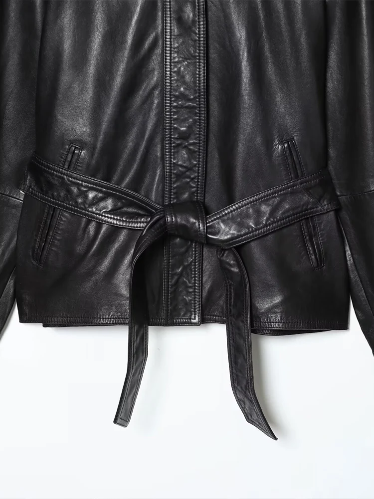 Estilo europeu novo feminino elegante e versátil cor sólida lapela manga comprida jaqueta de couro com cinto curto.