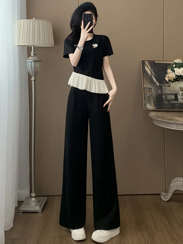 

Элегантный повседневный комплект для женщин: летний дизайн, черный топ с коротким рукавом и широкие брюки, стильный и изысканный комплект из смесового хлопка.