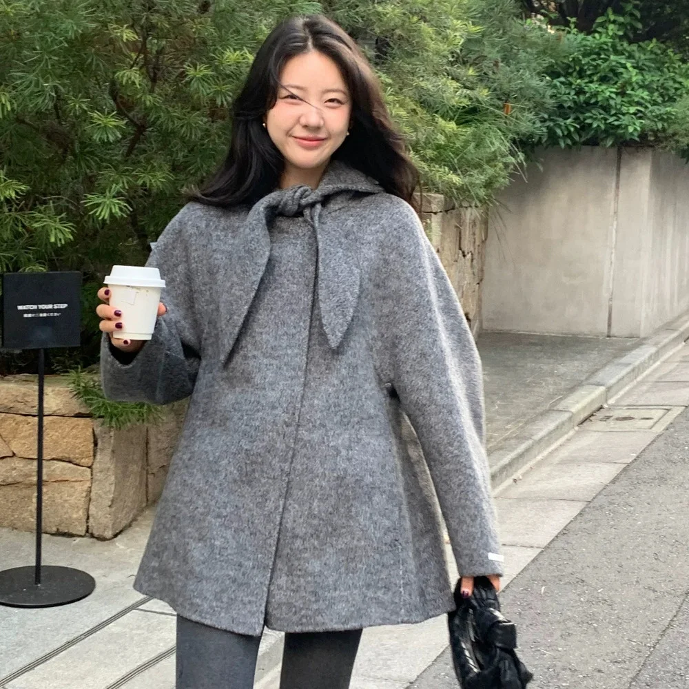 Cappotto di lana coreano con orecchie di coniglio Sle A-Line Capispalla di media lunghezza per le donne Stagione invernale Chiusura lunga con bottone singolo