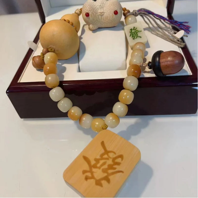

Tuo Bone Hair Siberian Hazelnut Diffuse Gourd Quagai Peach Wood Bell Buddha Beads Bracelet