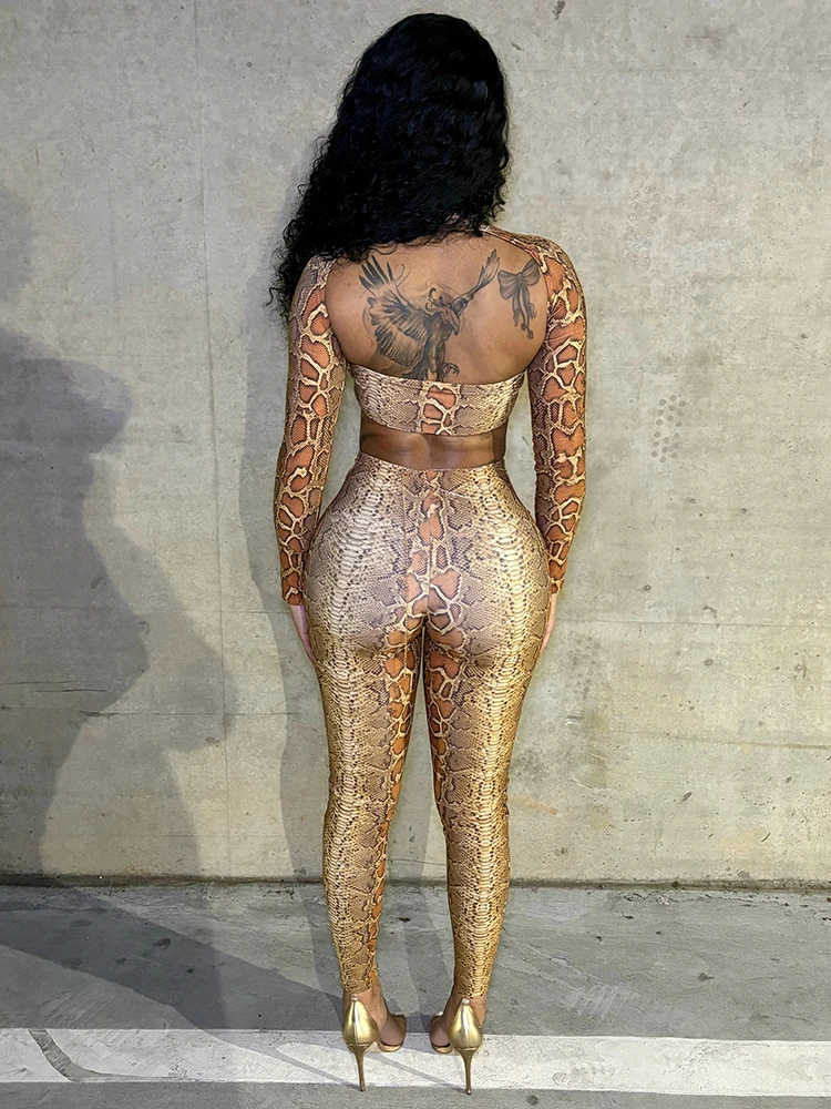 Sisterlinda バックレス スネークプリント 2 ピースセット女性ヒップスター中空胸ラップクロップトップ + レギンスセクシーなストレッチクラブウェア衣装