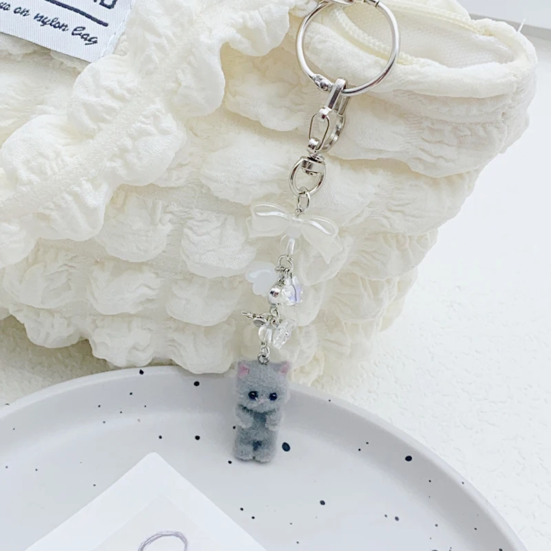 1PC Auto Schlüssel Halter Beflockung Katze Schlüsselring Bowknot Kleine Blume Perle Anhänger Telefon Lanyard Tier Schlüssel Kette Charme Zubehör