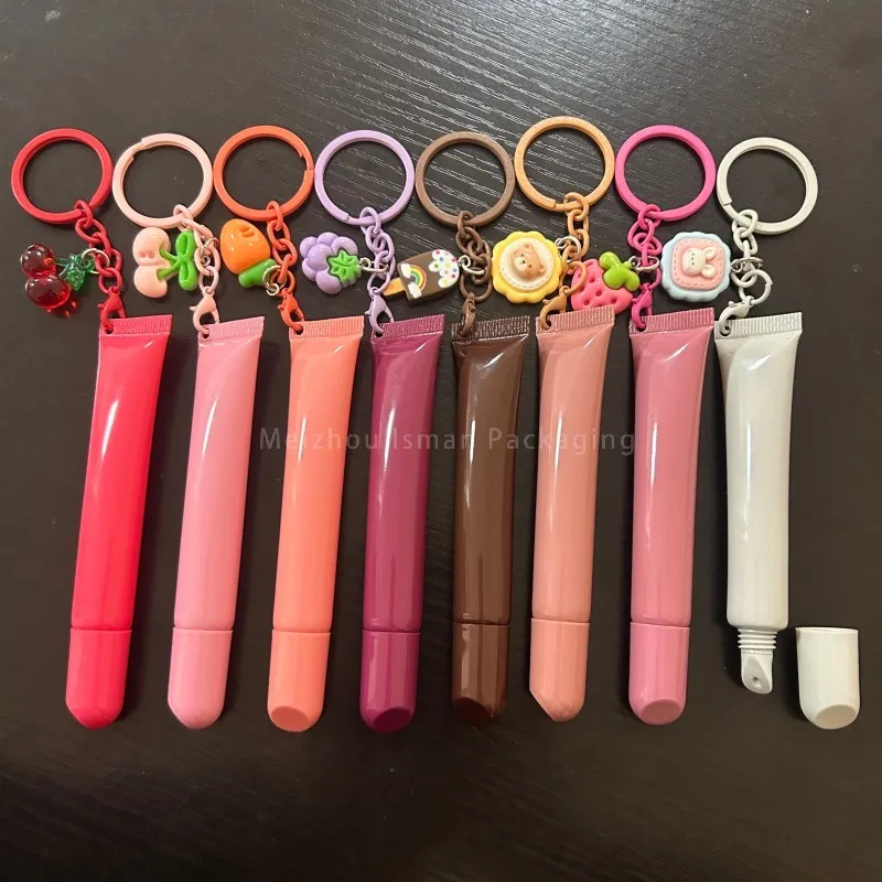 

50Pcs Empty Pink White Plastic Lip Gloss Squeeze Bottle Cream Lotion 10ml Soft Lip Balm Squeeze Container Tube with Keychain