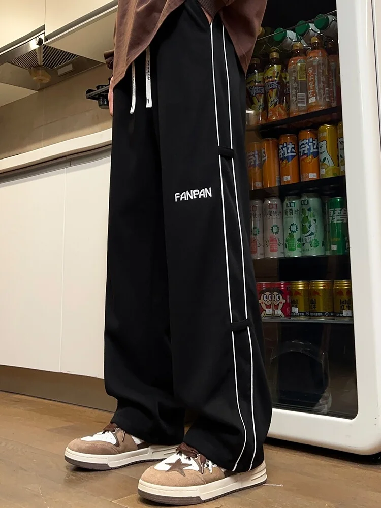 

Мужские спортивные брюки 2025: Новинка, весенние, прямые, свободные, струящиеся, широкие штанины, американские, из плотной ткани, модные, в полоску, с лоскутным дизайном