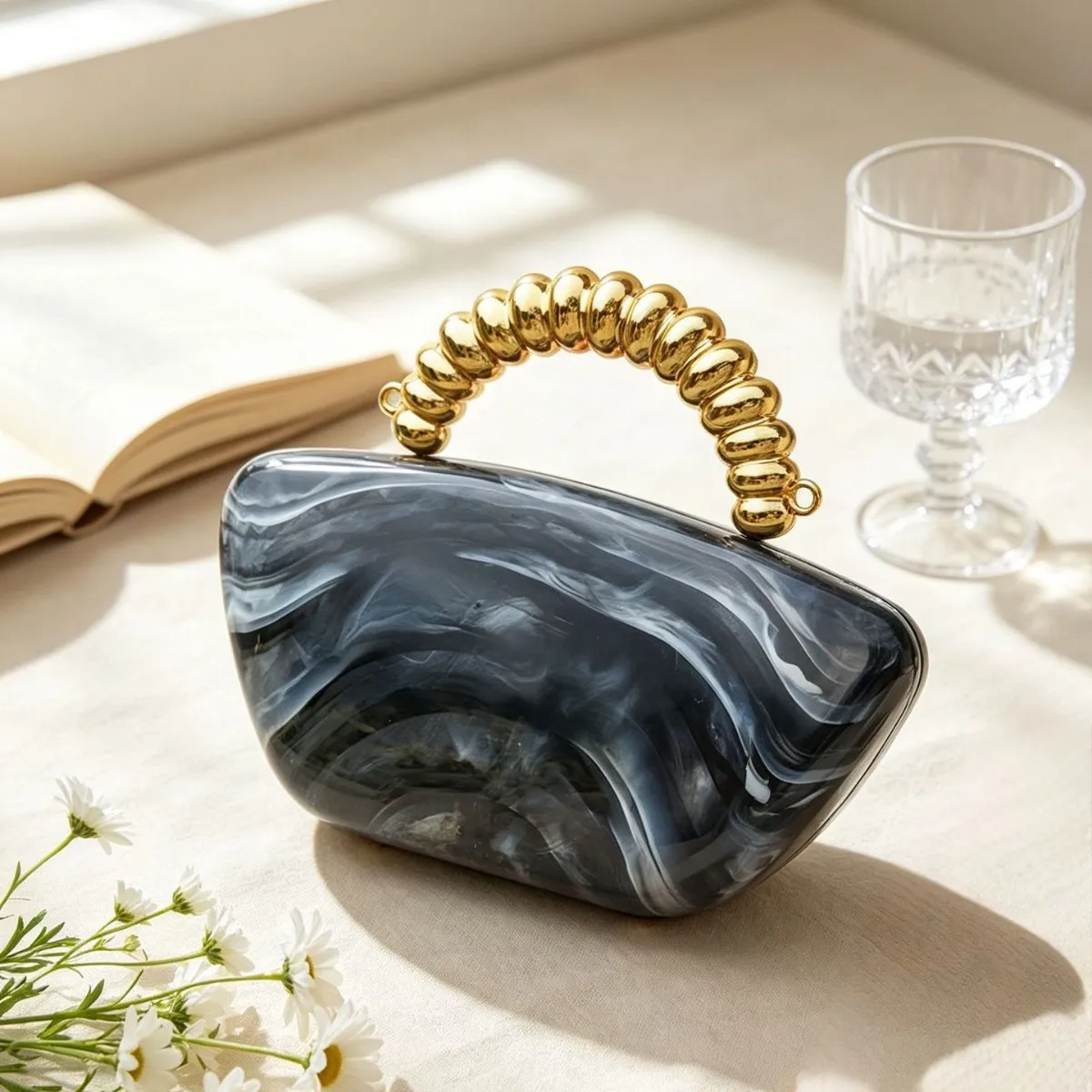 Amber smudged acrylic dinner bag gilt bead string handle warm marble texture light luxury premium handbag