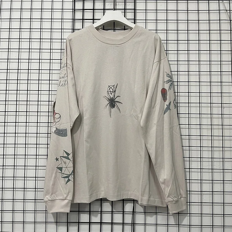 

Men Women Casual Cartoon Graphics Graffiti Print Saint Long Sleeved T-Shirt Best Quality Cotton Cement White Base T-Shirt Loose