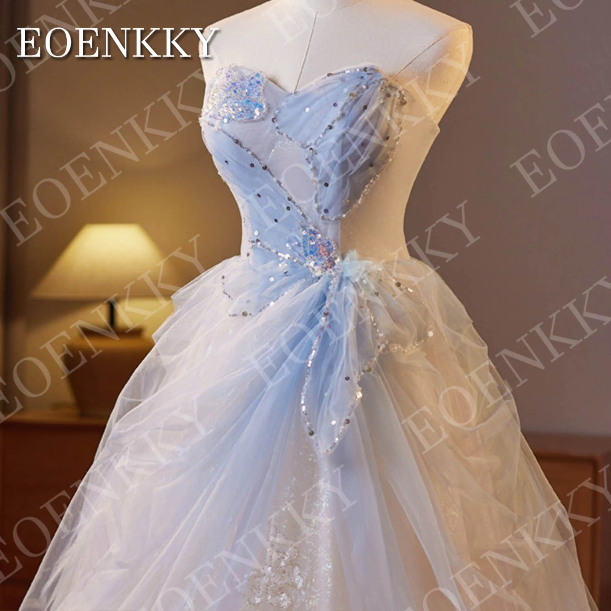 فستان EOENKKY فاخر باللون الأزرق الفاتح للحفلات الراقصة 2025 على شكل قلب ترتر خرز الأميرة اللامعة على شكل فراشة تول فساتين التخرج مخصصة فستان الرفيعة الزرقاء الفاخرة 2025 حبيبتي بائكة حبة الأميرة براقة فراشة تول فساتين