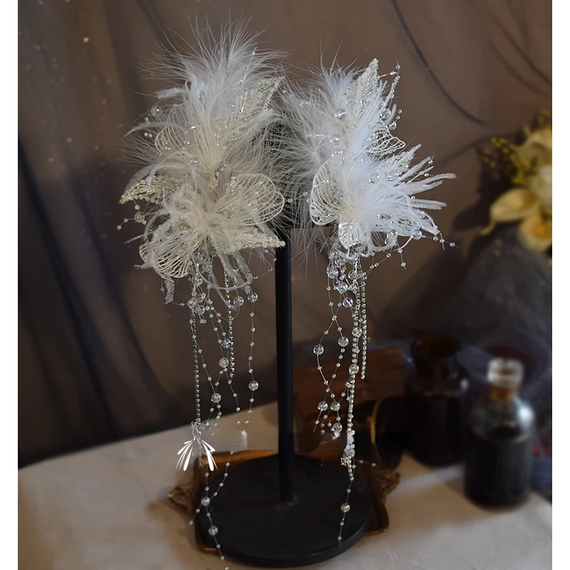 

Bridal headdress feather white lace super fairy princess beautiful fashion temperament elegant tassel clip wedding accessories.