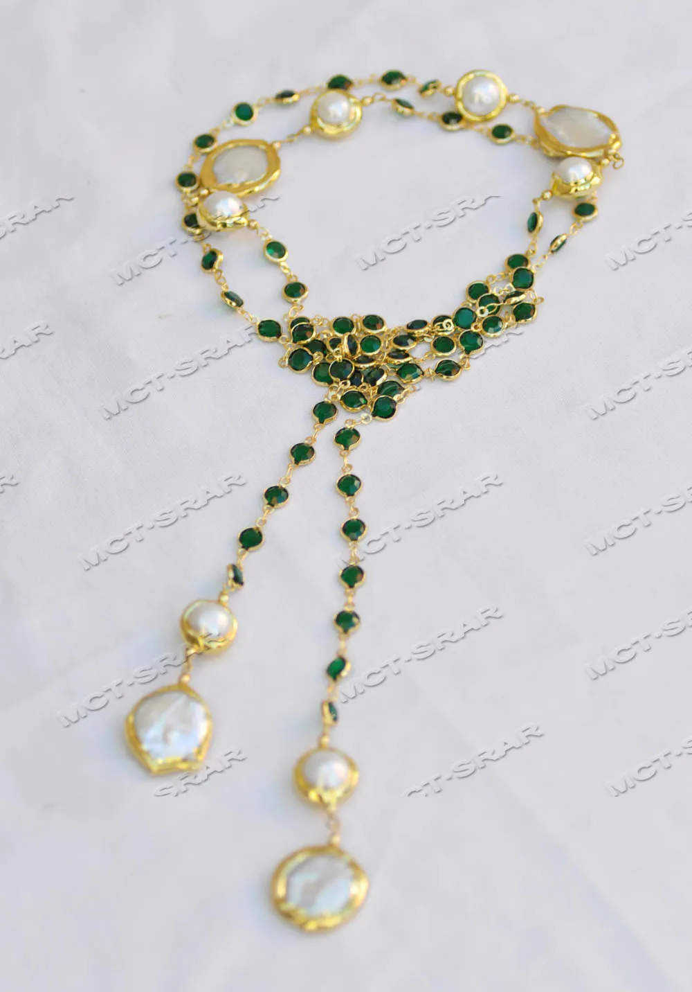 

Z11623 Ожерелье-цепочка с белыми жемчужинами 46 дюймов, 22 мм, и зелеными фианитами