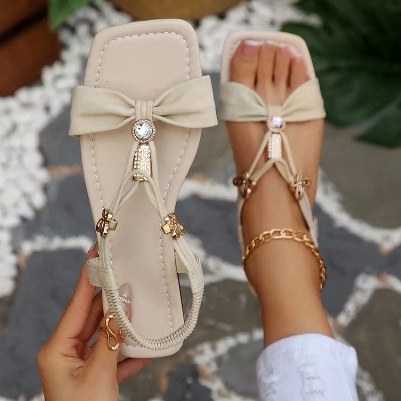 

Women Elegant Flat Sandals Square Open Toe Bowknot Rhinestone T-Strap Elastic Slingback Summer Casual Beach Ladies Footwear 2026