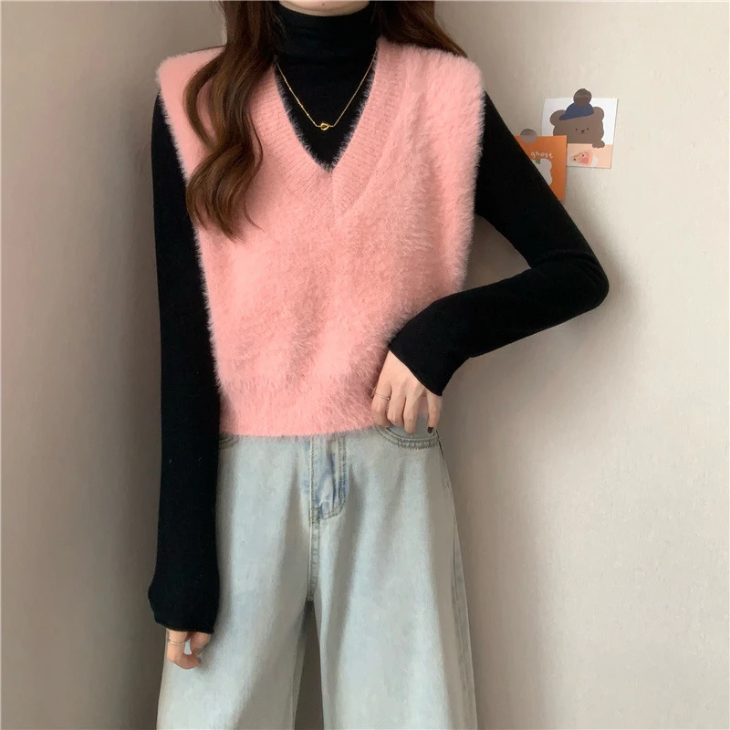 

Женские свитерные жилеты на осень: асимметричные карманы, круглый вырез, спущенные плечи, пуговицы, без рукавов, свободный крой, в стиле Highstreet, для офиса