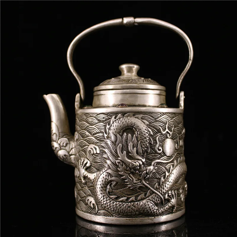 Antique silver teapot and wine pot featuring a dragon playing a pearl, handcrafted by an old silversmith, with a handle, su