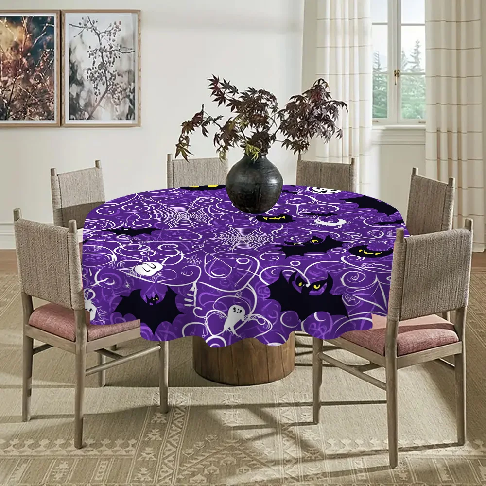 One Halloween-themed tablecloth, featuring a pattern of spooky spider webs and bats.zyc