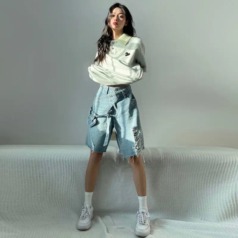 Pantaloncini di jeans a cinque punti per ragazza calda e sottile dal design nazionale alla moda