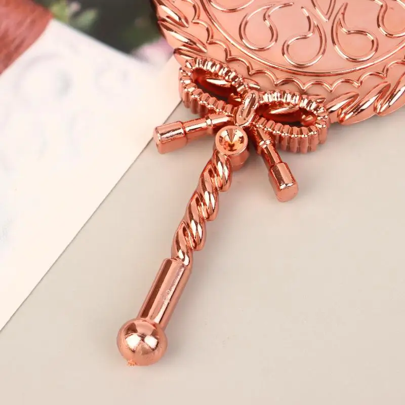 กระจกแต่งหน้าแบบมือถือ 1 ชิ้น พร้อมโบว์ กระจกแต่งหน้าทรงกลมแบบพกพา สไตล์ยุโรป หรูหราแบบราชสำนักโบราณ