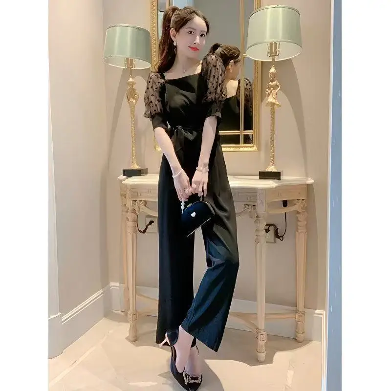 Tuta nera di fascia alta Tuta estiva sottile da donna con maniche a sbuffo Tuta elegante slim con top a tubo lungo