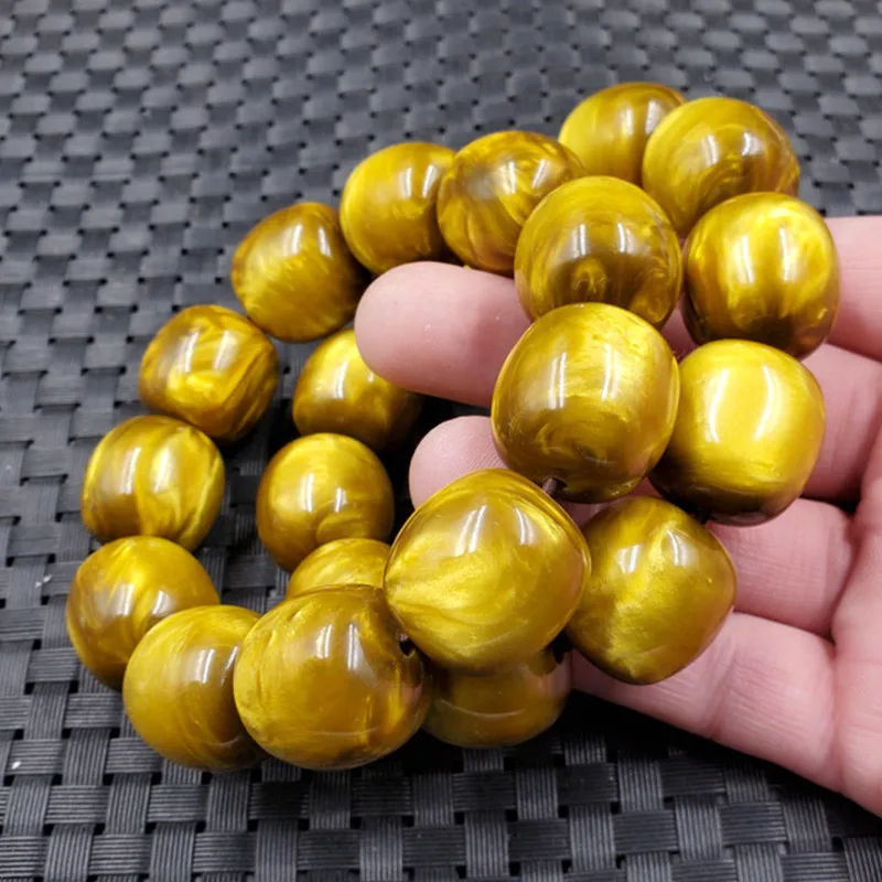 Jade and artificial amber barrel bead , gold thread sea willow lucky charm , jewelry bracelet, hand chain
