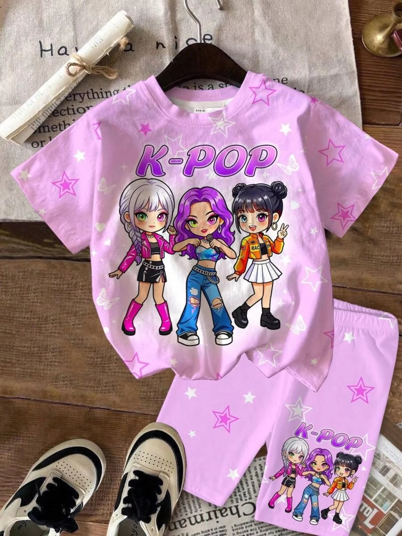Girls' K-pop-inspired two-piece set featuring an all-over print of stars and butterflies; includes a crew-neck, short-sleeved