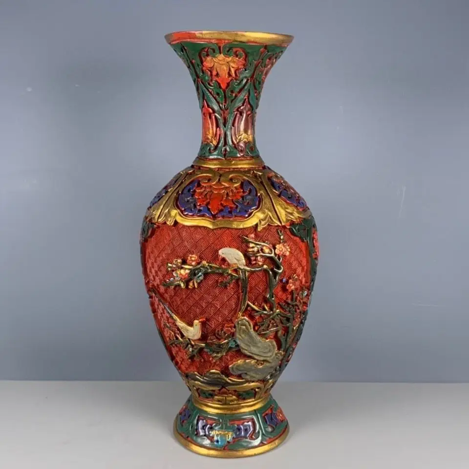 A reproduction of a Qing Dynasty Qianlong period lacquerware and hand-painted flower-and-bird vase ornament