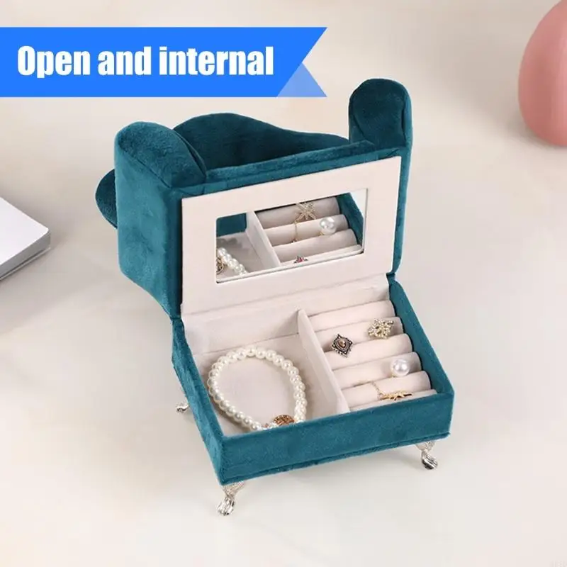 

Текстура бархатов отсеков практичного футляра для ювелирных изделий формы дивана многофункциональная