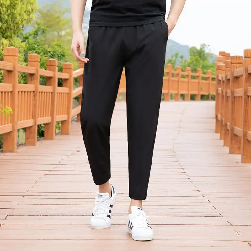 

Men Black Solid Color Casual Pants Elastic Waist Tapered Ankle Length Trousers Comfortable Daily Wear