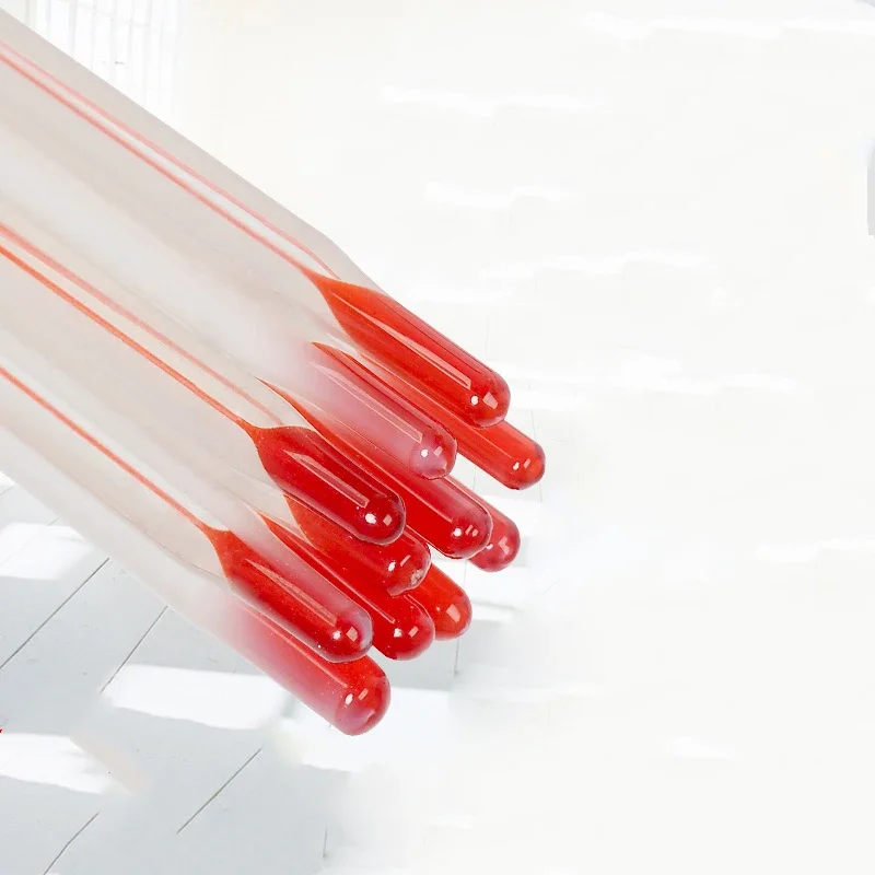 Glass Beaker with Red Liquid Mercury Thermometer and Glass Rod for Laboratory Testing