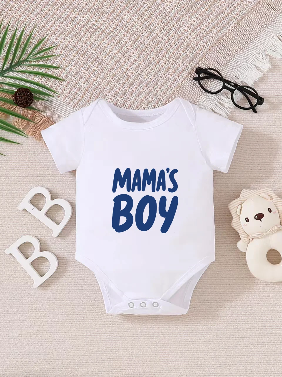 

Playful letter-printed baby short-sleeve triangle bodysuit. Button closure for easy dressing, machine washable