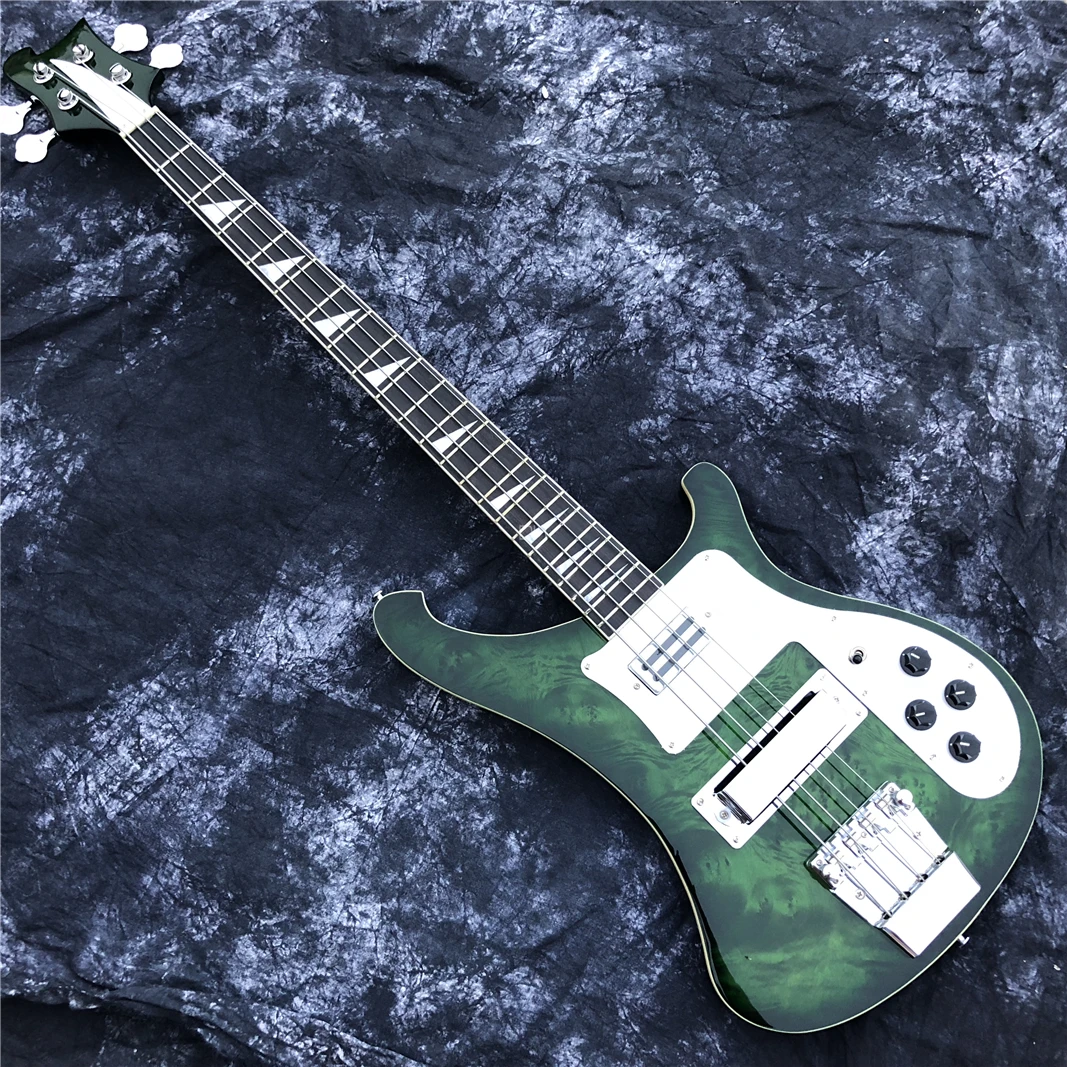 This is a professional 4-string bass electric guitar with a sunset color changing bright face. It has a beautiful tone