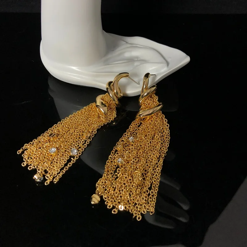Fashionable plain gold exquisite elegant tassels versatile stud earrings copper material claw rhinestone pendant