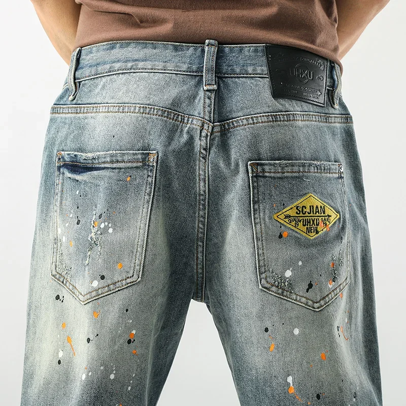 2024 Jeans corti estivi pantaloni da uomo pittura stampata pantaloncini di Jeans elasticizzati blu chiaro uomo Streetwear stile Punk Jeans da moto ragazzo