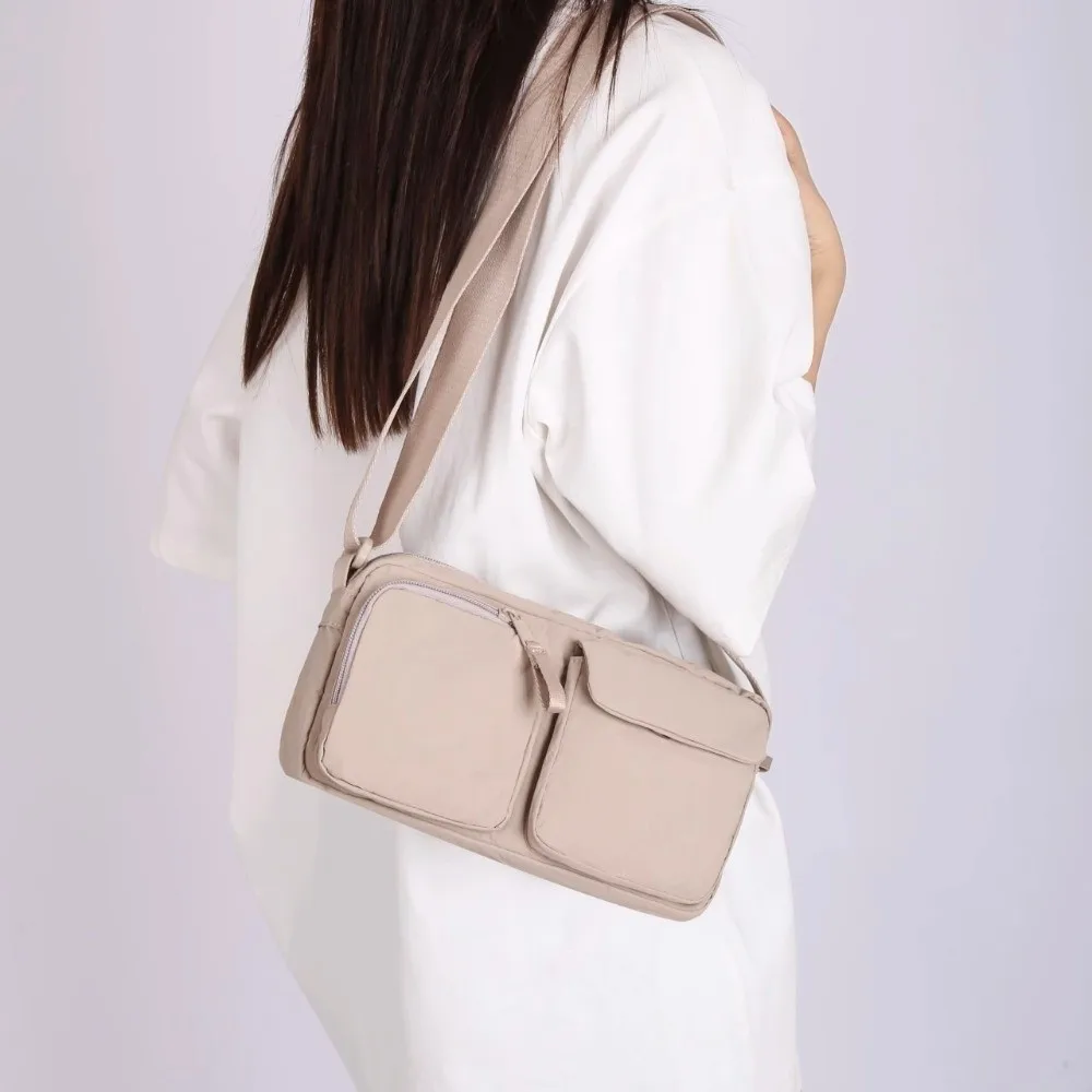 حقيبة كتف جديدة خفيفة الوزن للرجال للجنسين بحزام قابل للتعديل حقيبة كروس بدون استخدام اليدين متعددة الجيوب حقيبة سفر للاستخدام اليومي